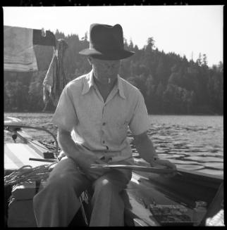Untitled (L.G. Saunders painting on deck of boat)