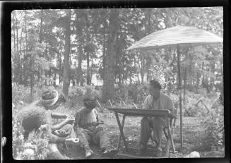 Untitled (woman at drawing table with friends)