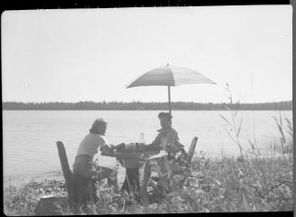 Untitled (two women under sun umbrella)