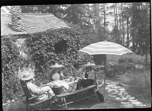 Untitled (group at picnic table)