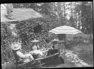 Untitled (group at picnic table)