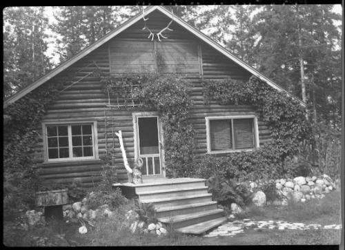 Untitled (facade of log cabin)