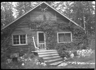 Untitled (facade of log cabin)