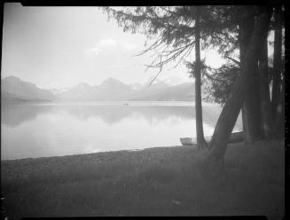 Untitled (beached rowboat and lake)