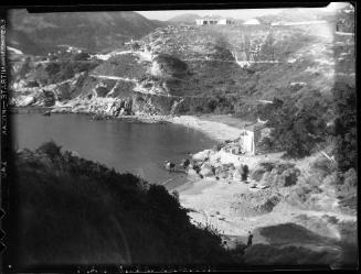 Untitled (beach with rocky cliffs)